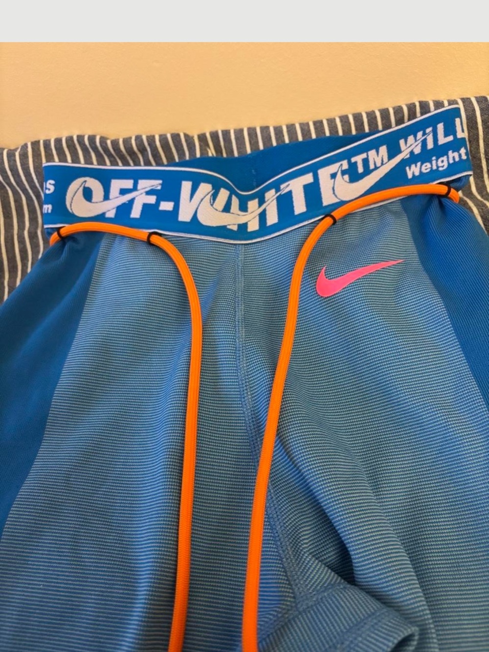 Nike Kids Blue Athletic Shorts with Pink Swoosh and Orange Drawcords